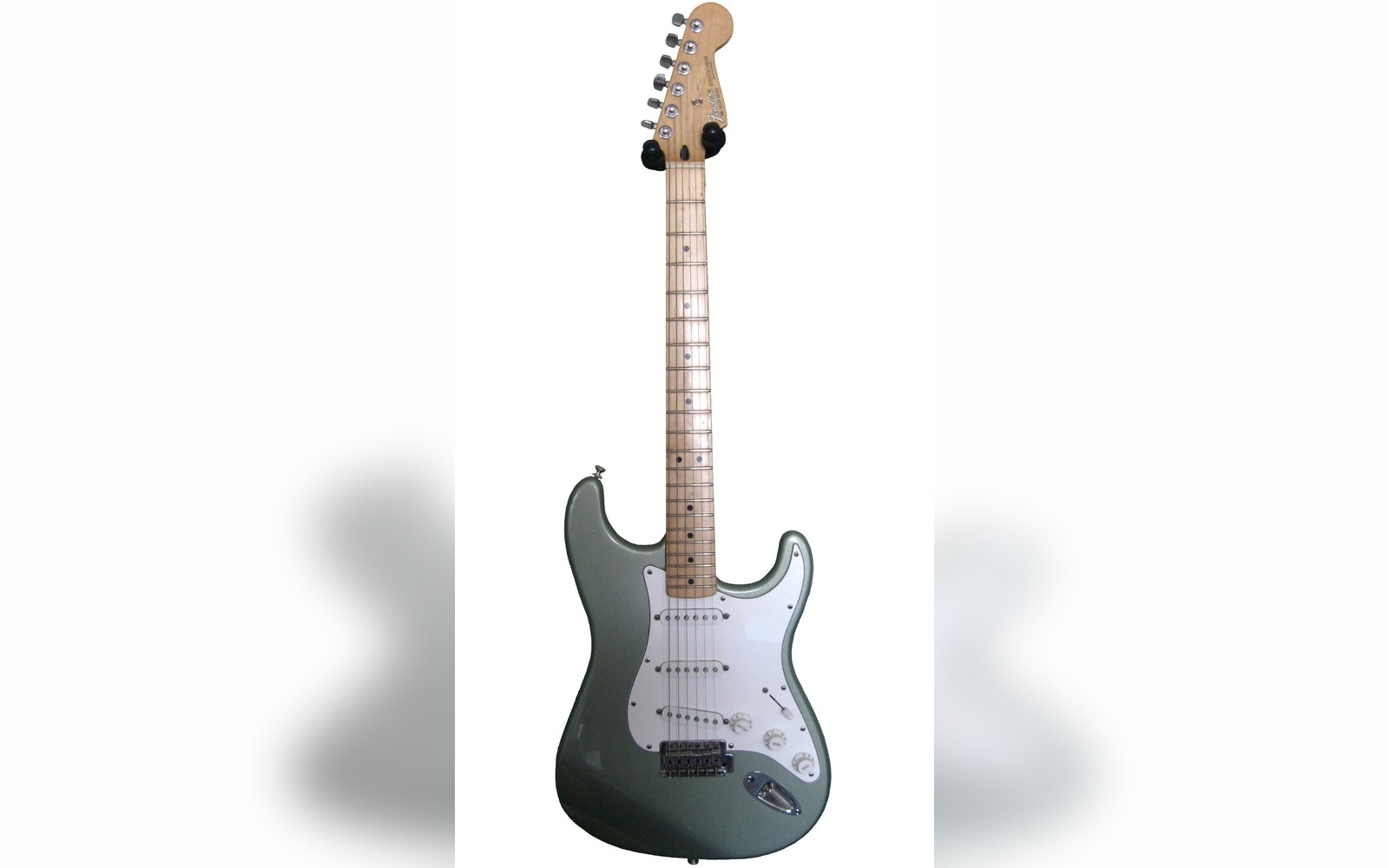Sage green Fender Stratocaster electric guitar with maple neck and white pickguard