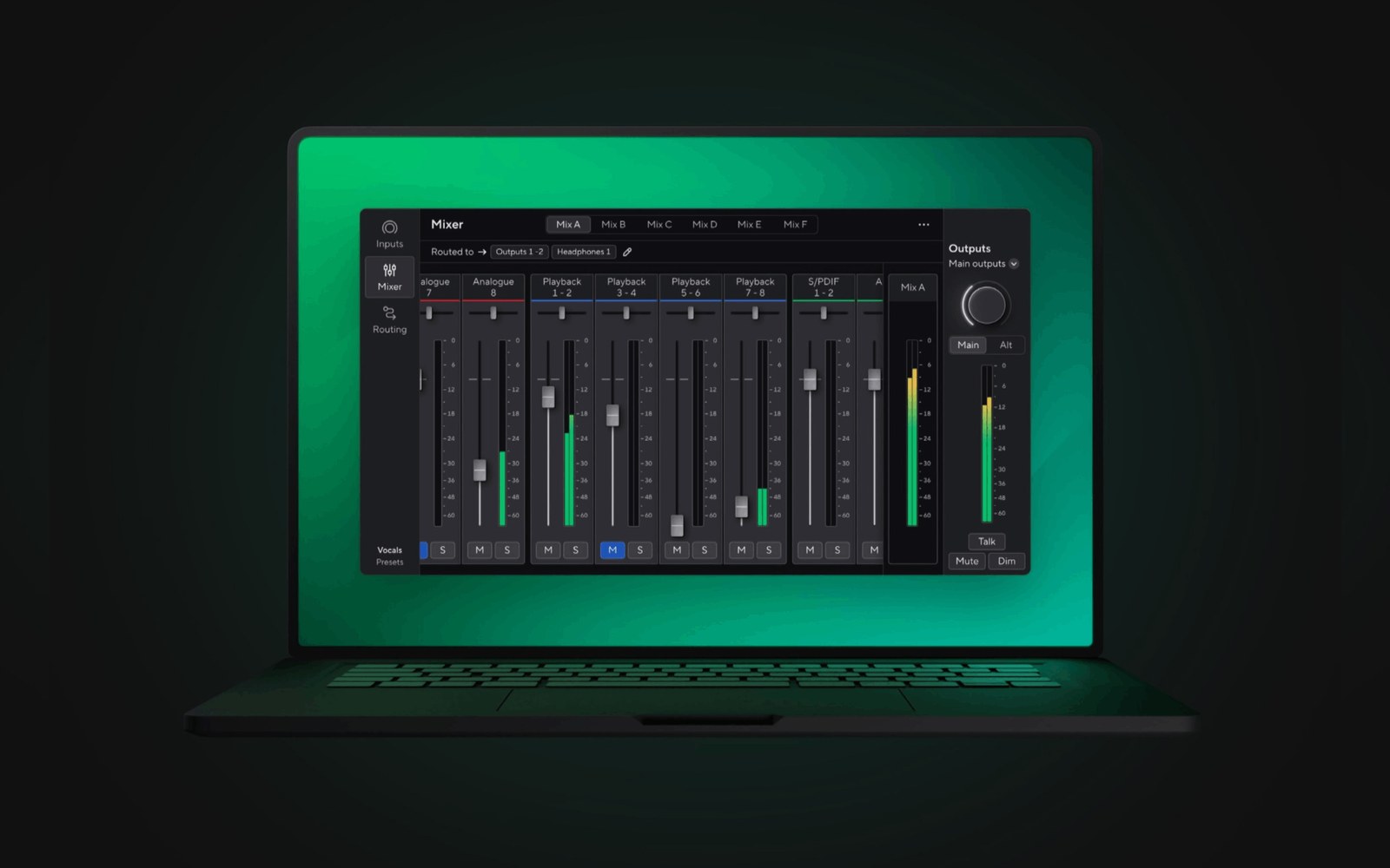 Laptop screen displaying Focusrite mixer software with multiple channel faders and output controls