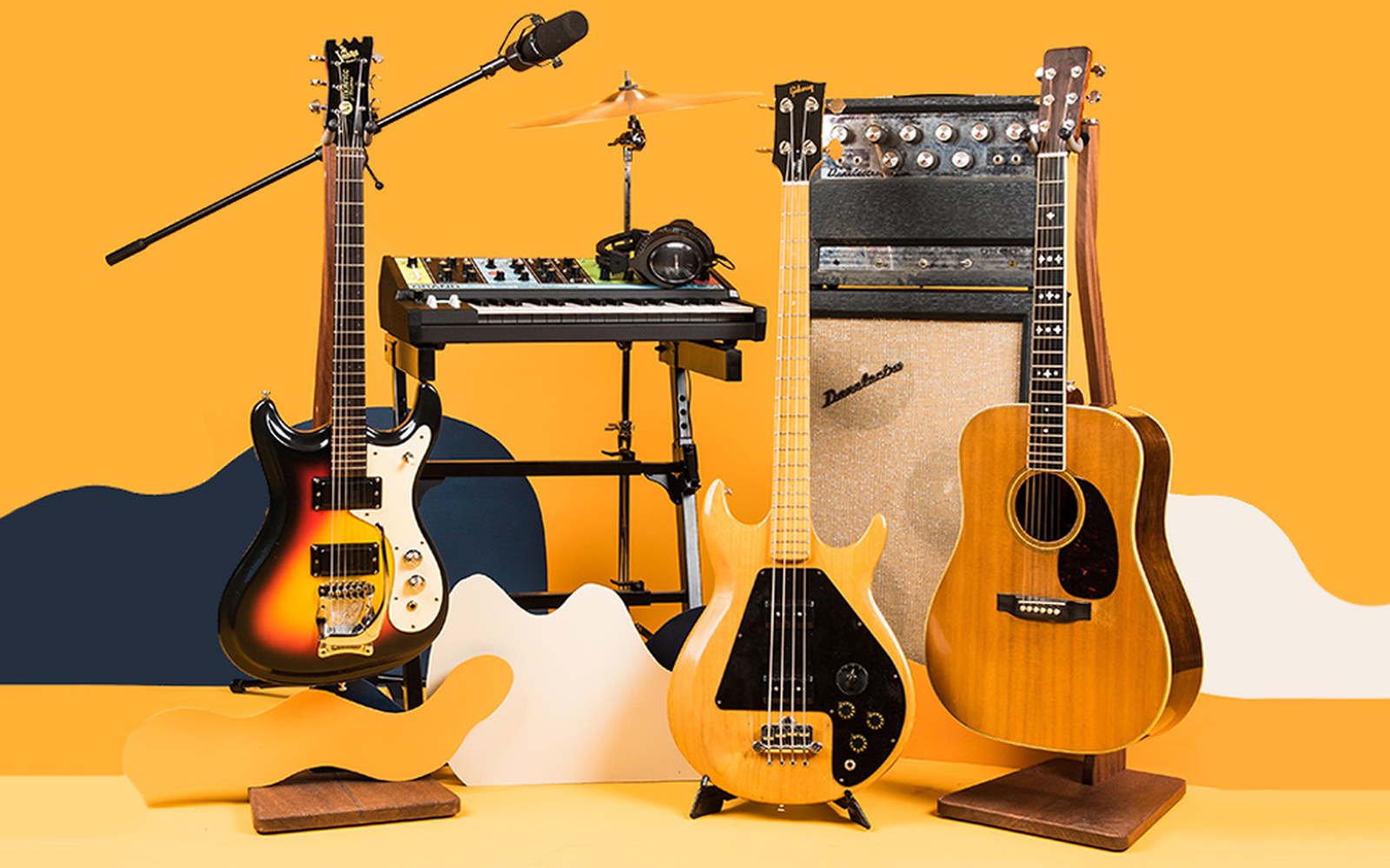 Electric guitars, an amplifier, acoustic guitar and synthesizer arranged against an orange backdrop